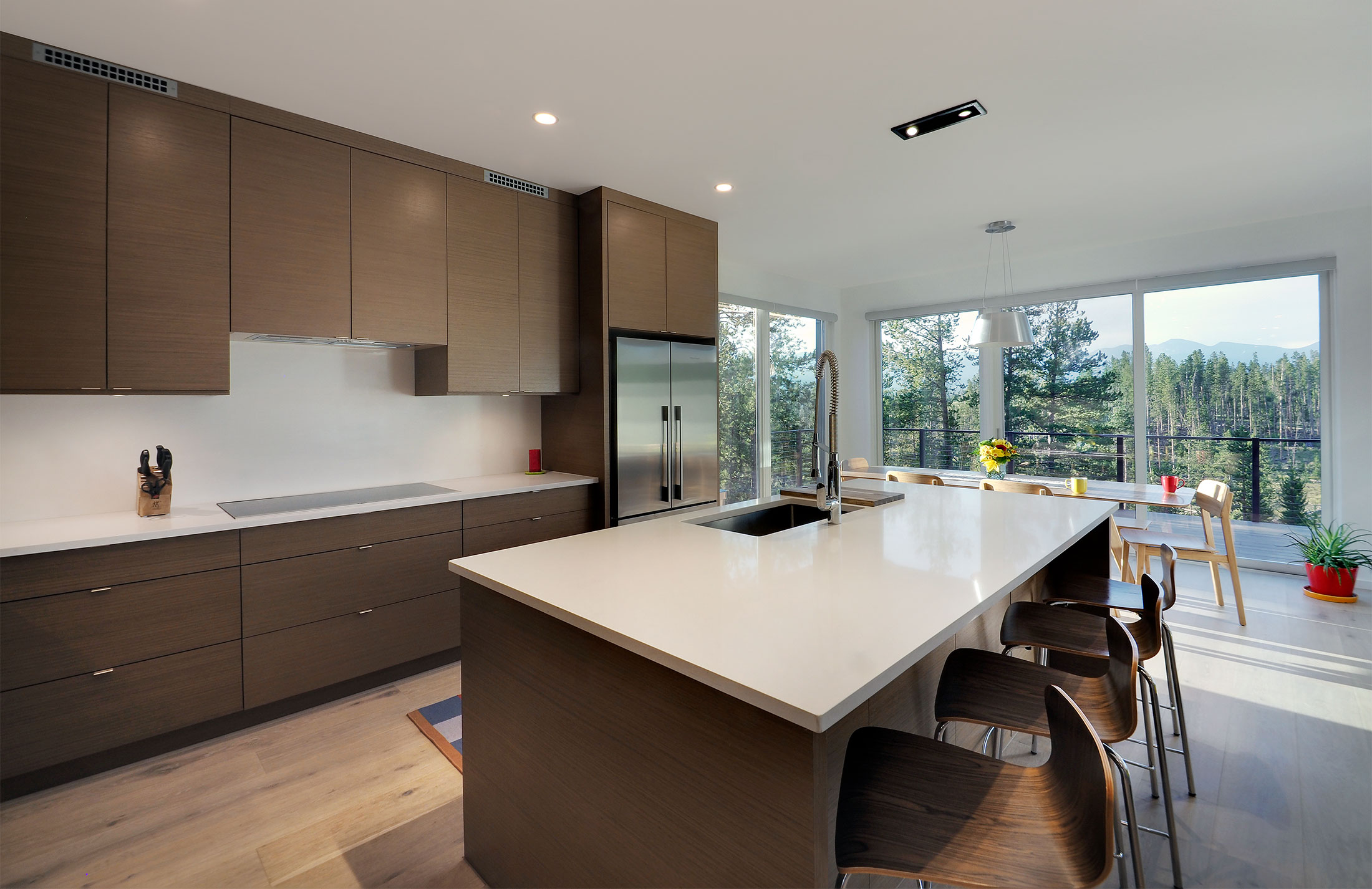 inside a modern prefab home with mountain view